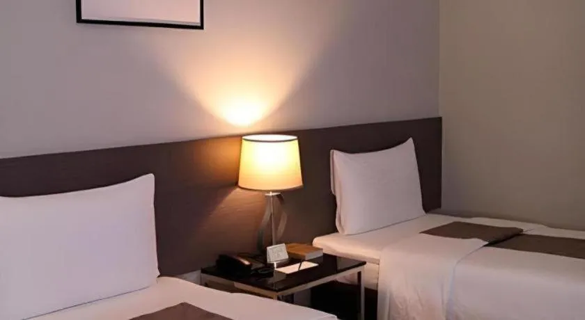 Bed in Sequoia Hotel Quezon City