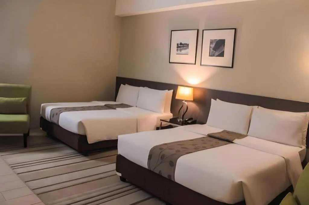 Bed in Sequoia Hotel Quezon City