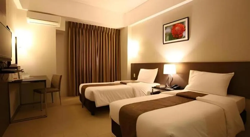 Bed in Sequoia Hotel Quezon City