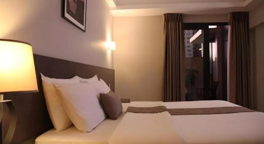 Bed in Sequoia Hotel Quezon City