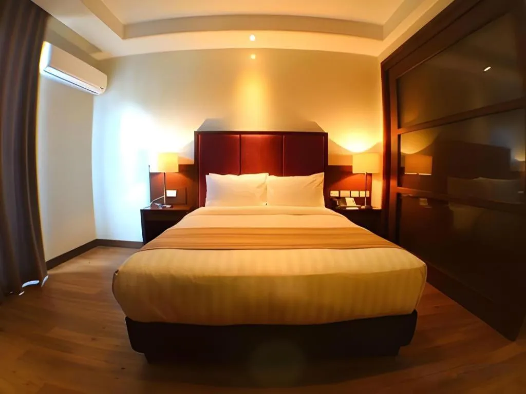 Bed in Mansion Garden Hotel