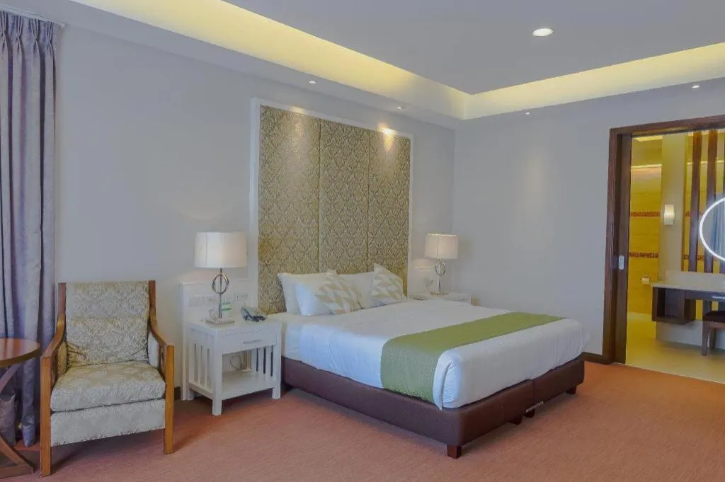 Bed in Mansion Garden Hotel