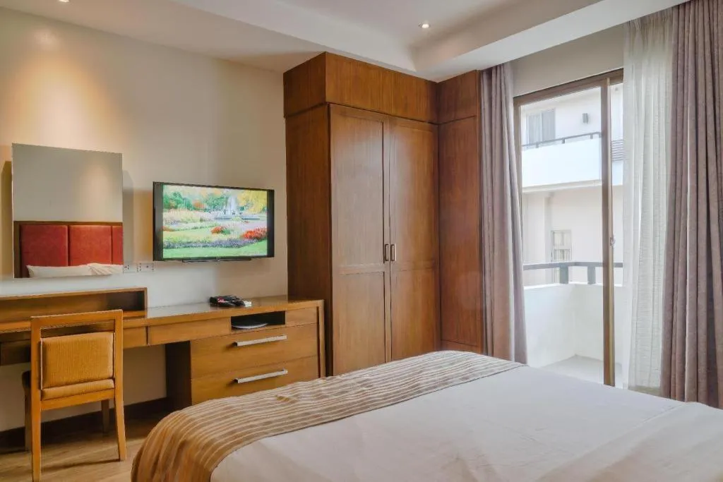 Bed in Mansion Garden Hotel