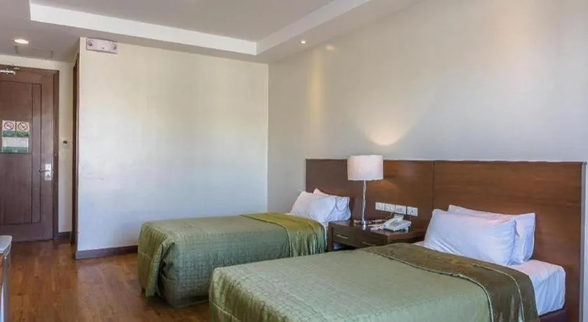 Bed in Mansion Garden Hotel