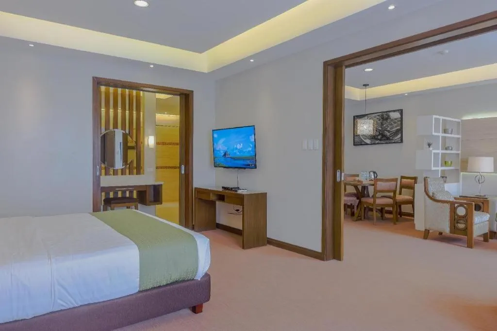 Bed in Mansion Garden Hotel