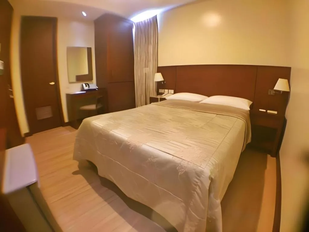 Bed in Mansion Garden Hotel