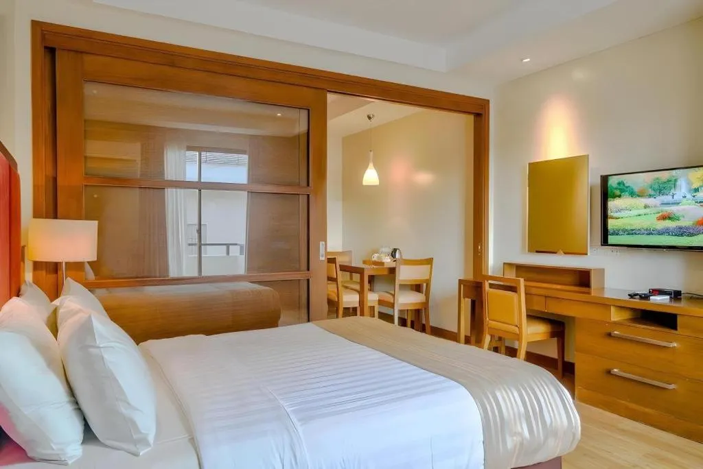 Bed in Mansion Garden Hotel