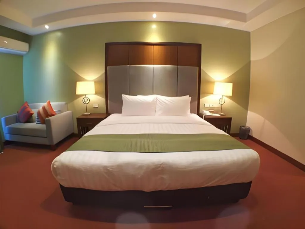 Bed in Mansion Garden Hotel