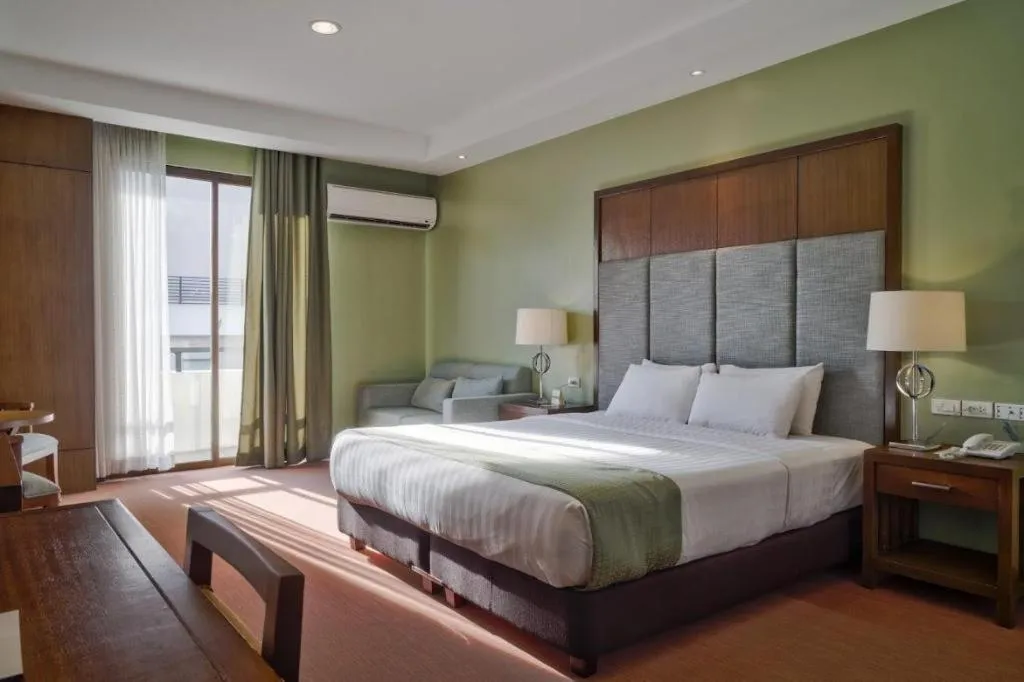 Bed in Mansion Garden Hotel