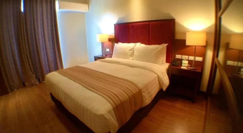 Bed in Mansion Garden Hotel