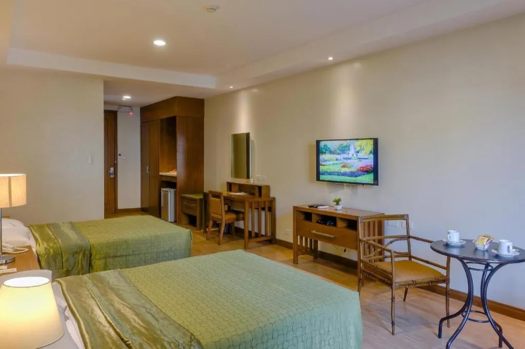 Bed in Mansion Garden Hotel