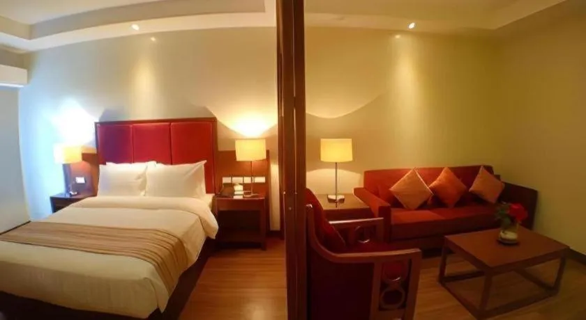 Bed in Mansion Garden Hotel