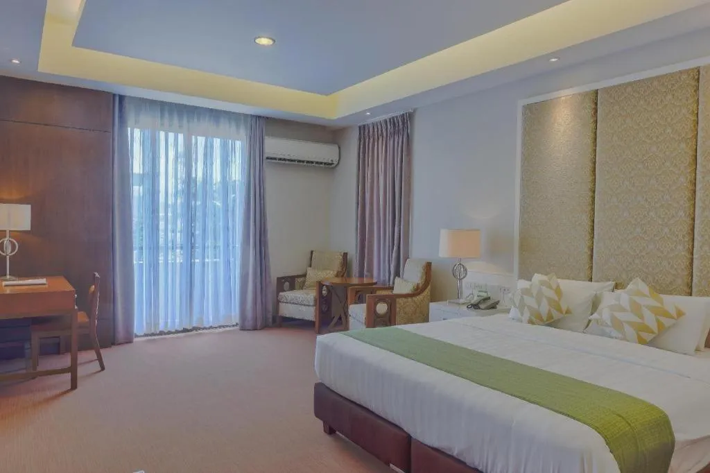 Bed in Mansion Garden Hotel