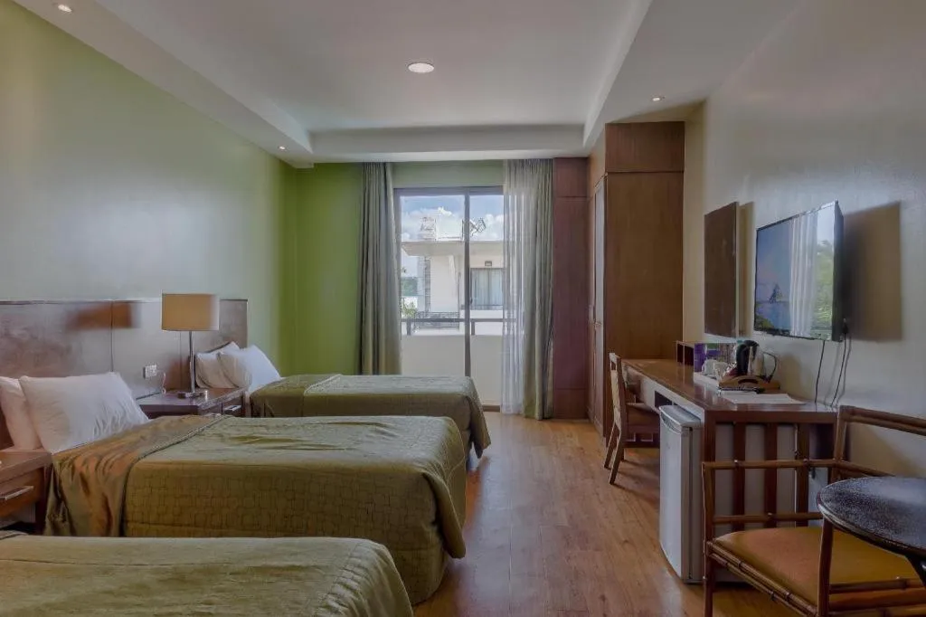 Bed in Mansion Garden Hotel