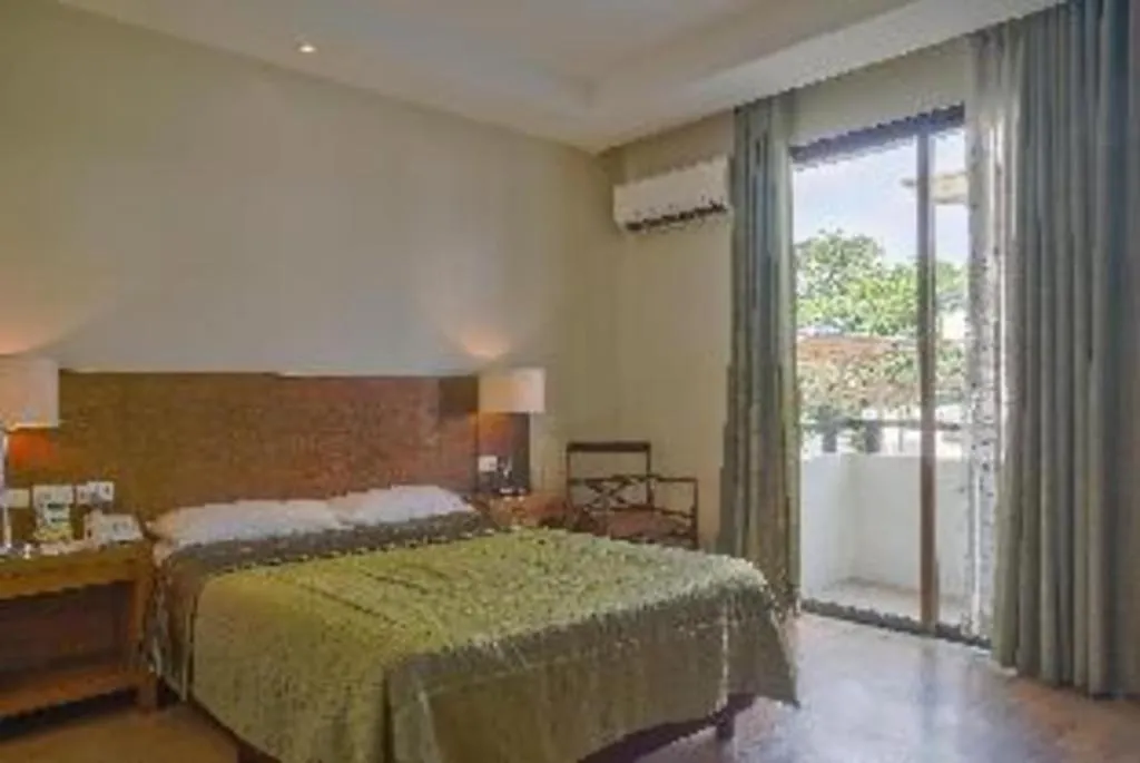 Bed in Mansion Garden Hotel