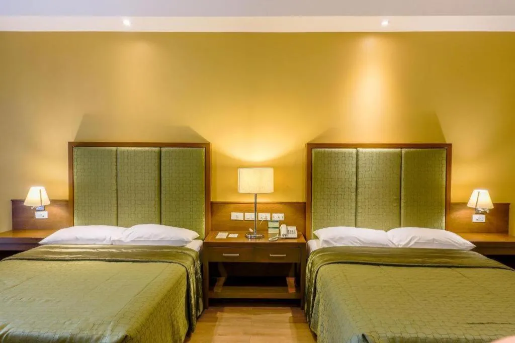 Bed in Mansion Garden Hotel