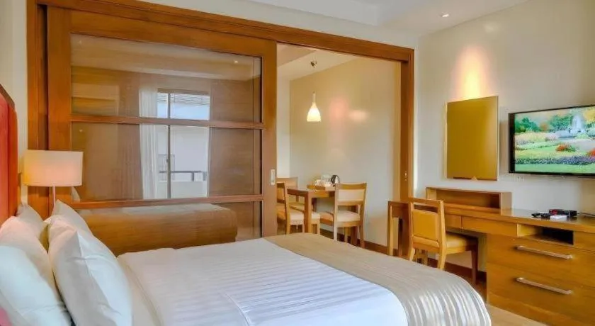 Bed in Mansion Garden Hotel