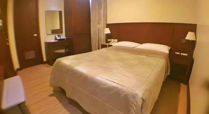 Bed in Mansion Garden Hotel