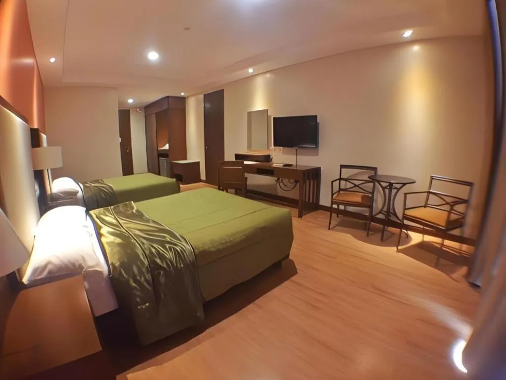 Bed in Mansion Garden Hotel