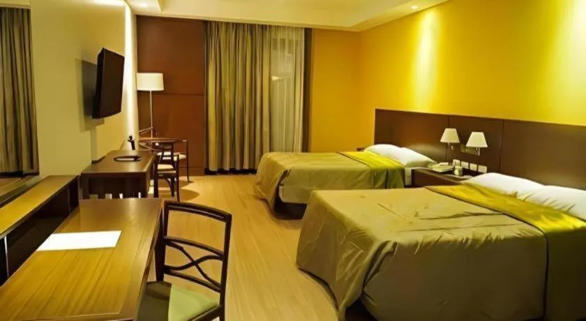 Bed in Mansion Garden Hotel