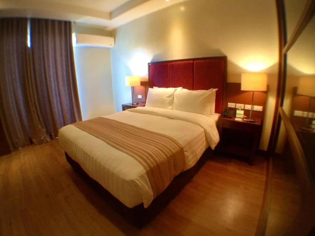 Bed in Mansion Garden Hotel