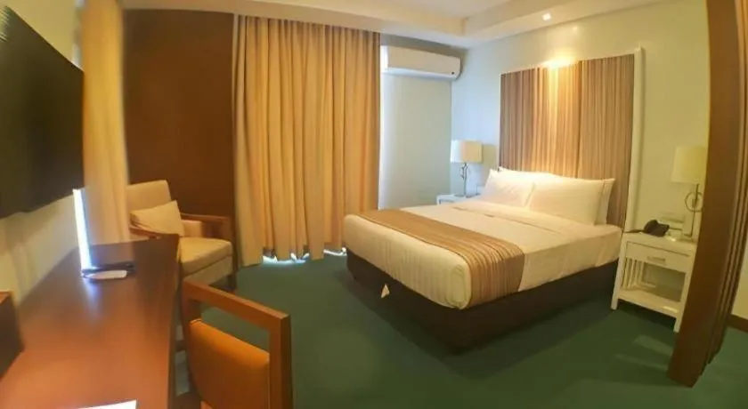 Bed in Mansion Garden Hotel