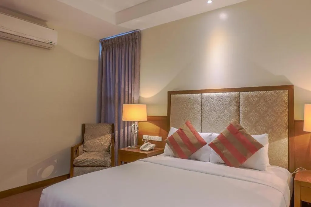 Bed in Mansion Garden Hotel