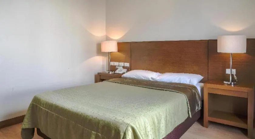 Bed in Mansion Garden Hotel