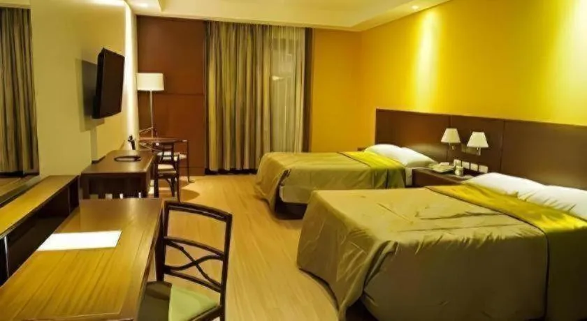 Bed in Mansion Garden Hotel