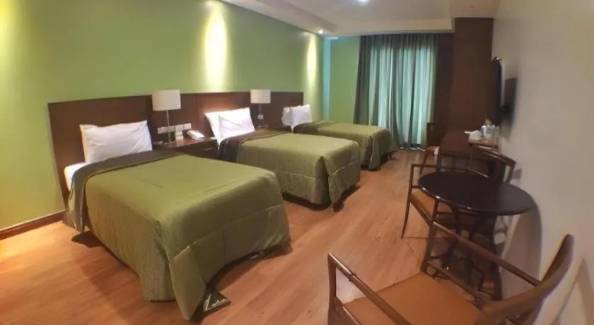 Bed in Mansion Garden Hotel