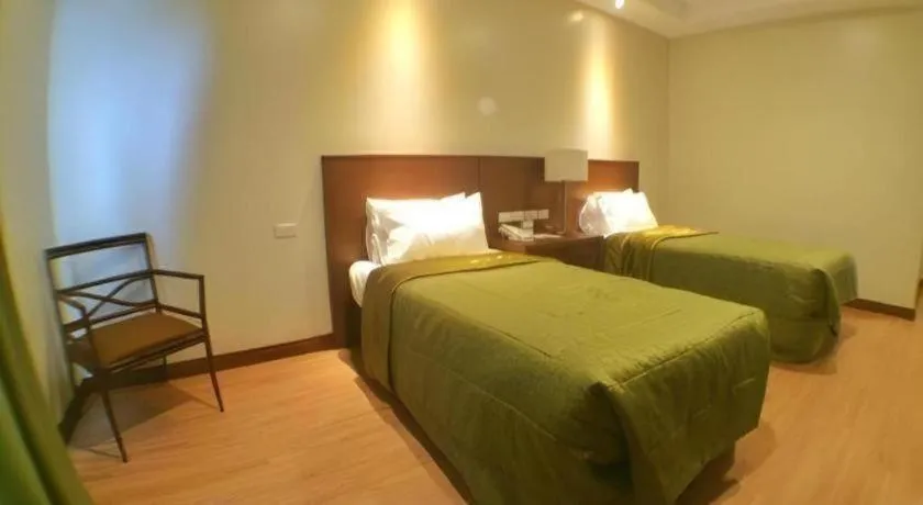 Bed in Mansion Garden Hotel