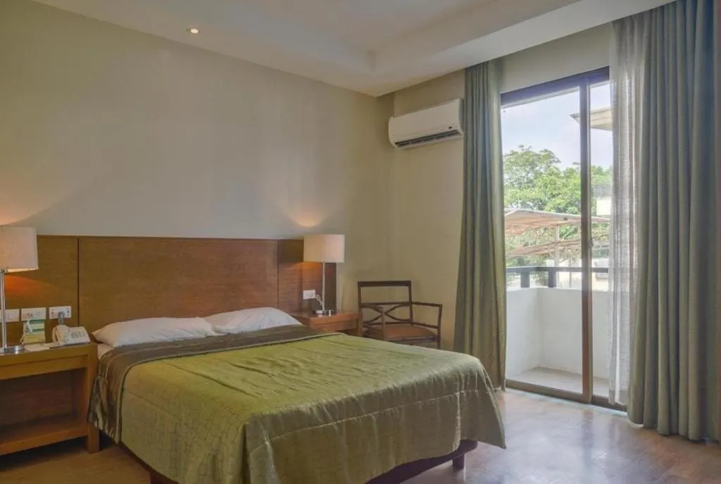 Bed in Mansion Garden Hotel