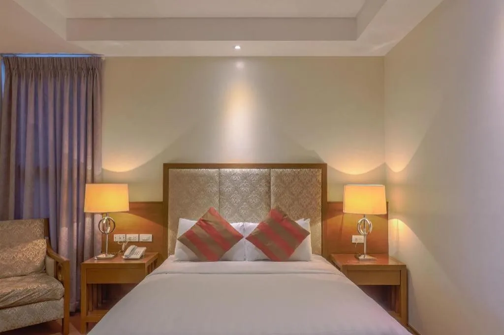 Bed in Mansion Garden Hotel