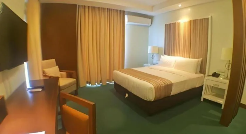 Bed in Mansion Garden Hotel