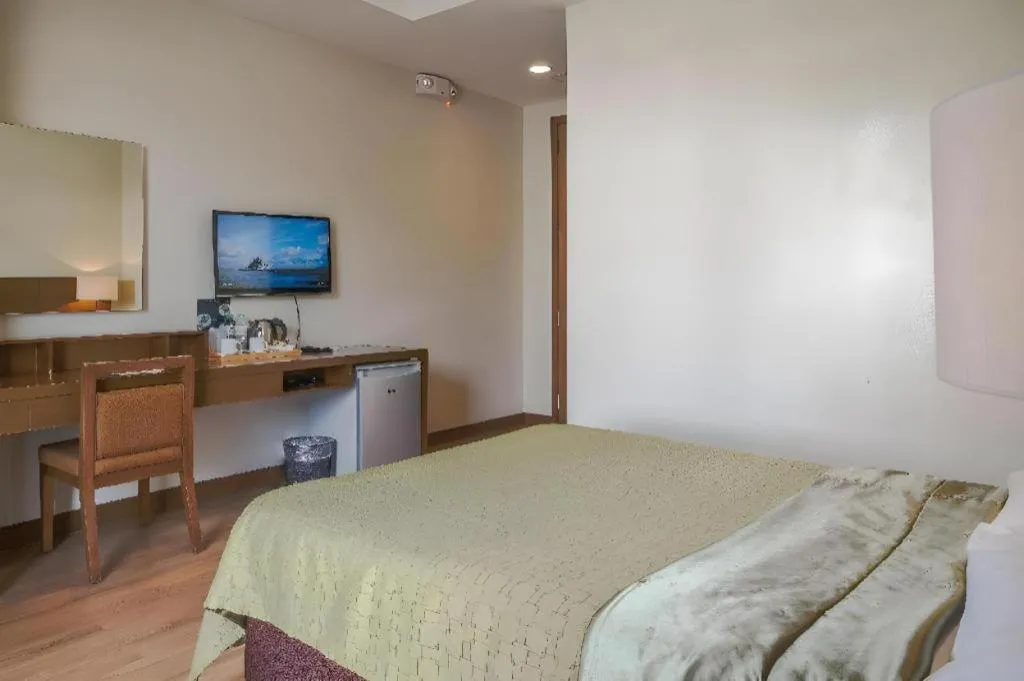 Bed in Mansion Garden Hotel