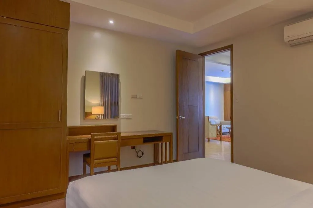 Bed in Mansion Garden Hotel