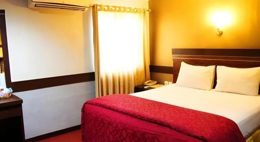 Bed in Hotel Menara Lexus