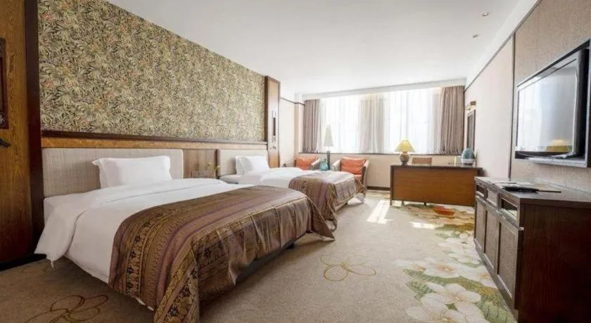 Bed in Riyuegu Hotsprings Resort