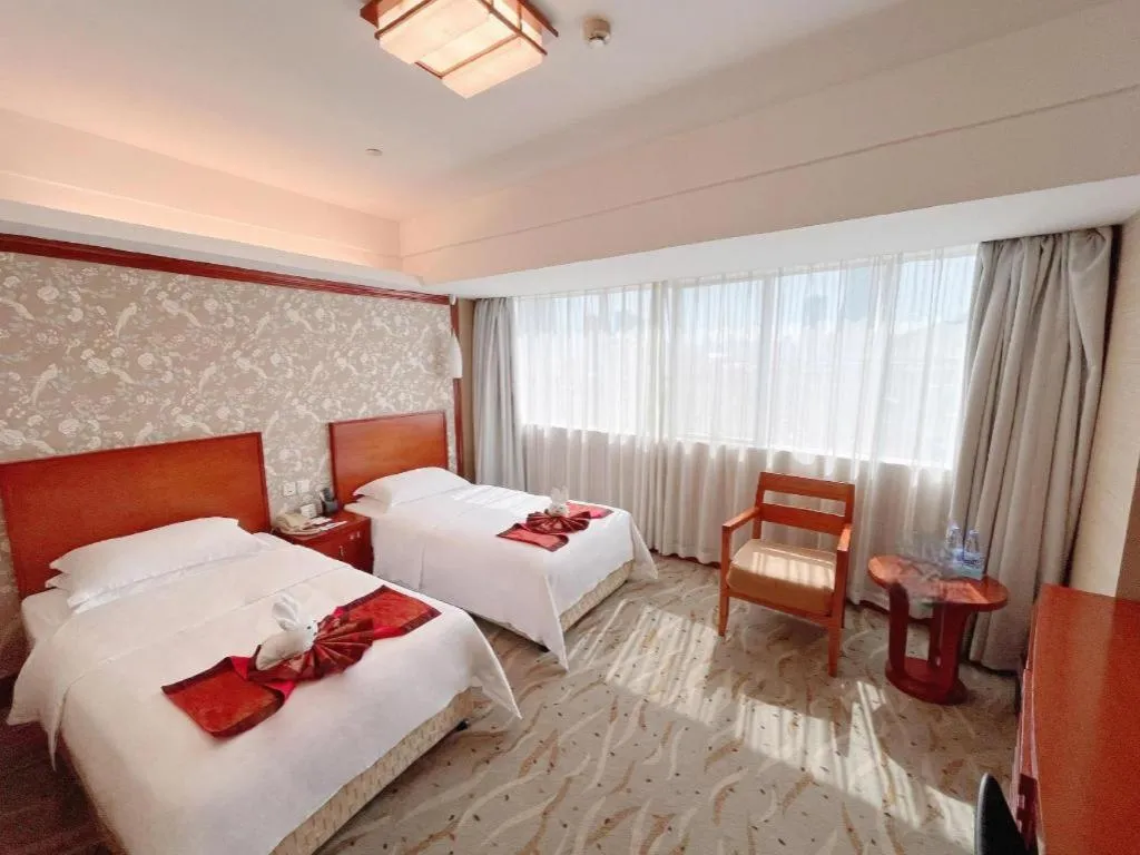 Bed in Xiamen Jingmin Central Hotel