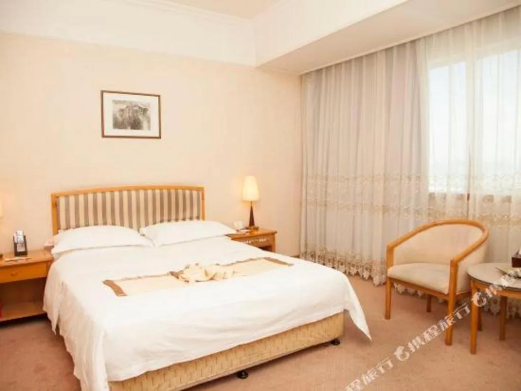 Bed in Xiamen Jingmin Central Hotel