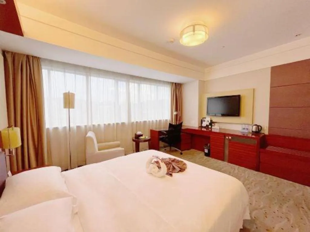 Bed in Xiamen Jingmin Central Hotel