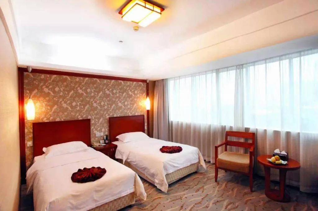 Bed in Xiamen Jingmin Central Hotel
