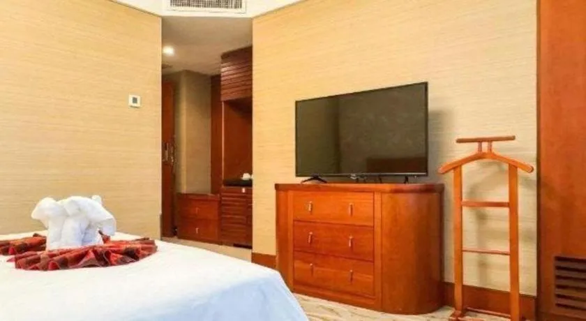 Bed in Xiamen Jingmin Central Hotel