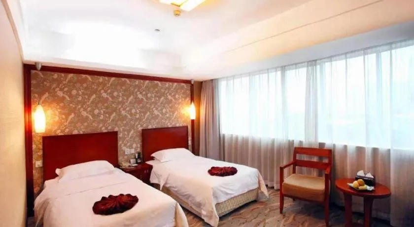 Bed in Xiamen Jingmin Central Hotel