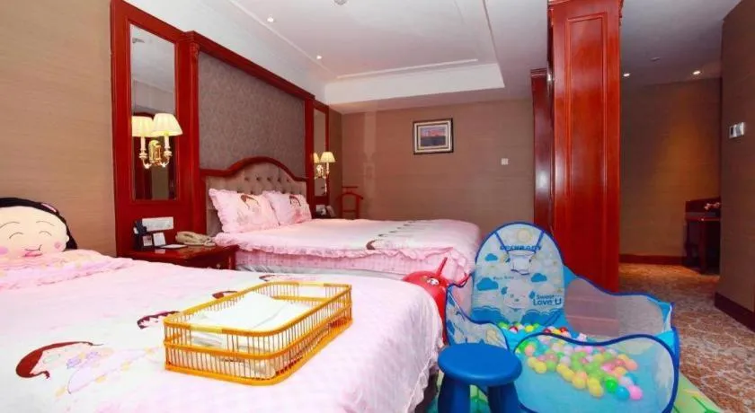 Bed in Xiamen Jingmin Central Hotel