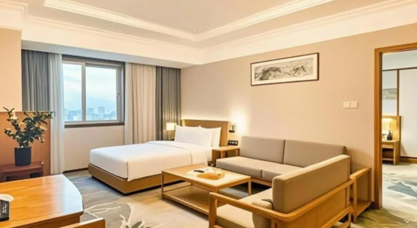 Bed in Xiamen Jingmin Central Hotel