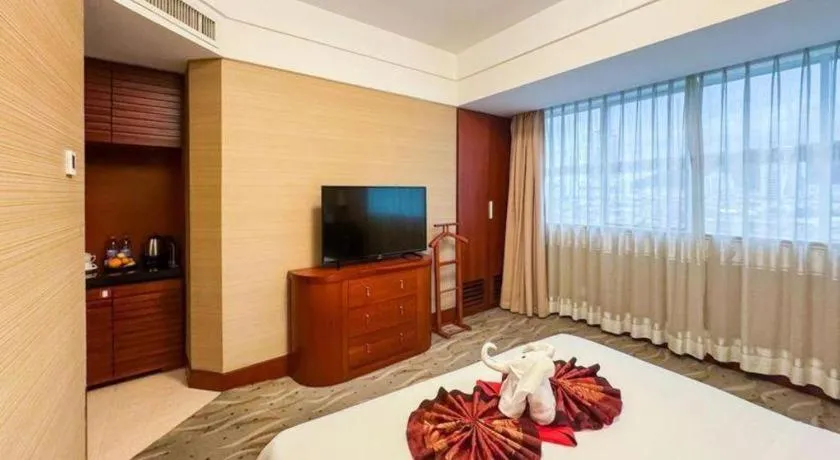 Bed in Xiamen Jingmin Central Hotel