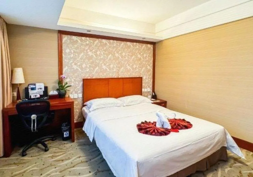 Bed in Xiamen Jingmin Central Hotel
