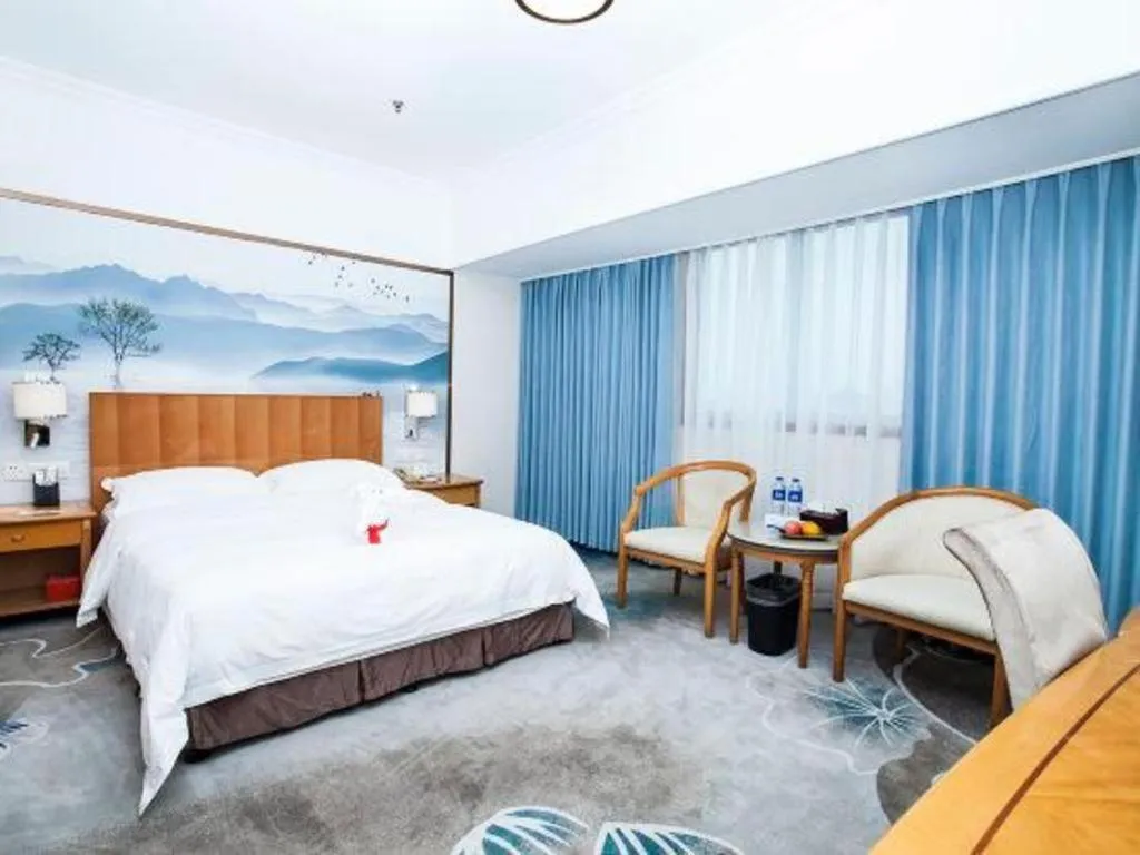 Bed in Xiamen Jingmin Central Hotel