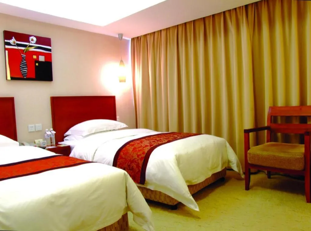 Bed in Xiamen Jingmin Central Hotel